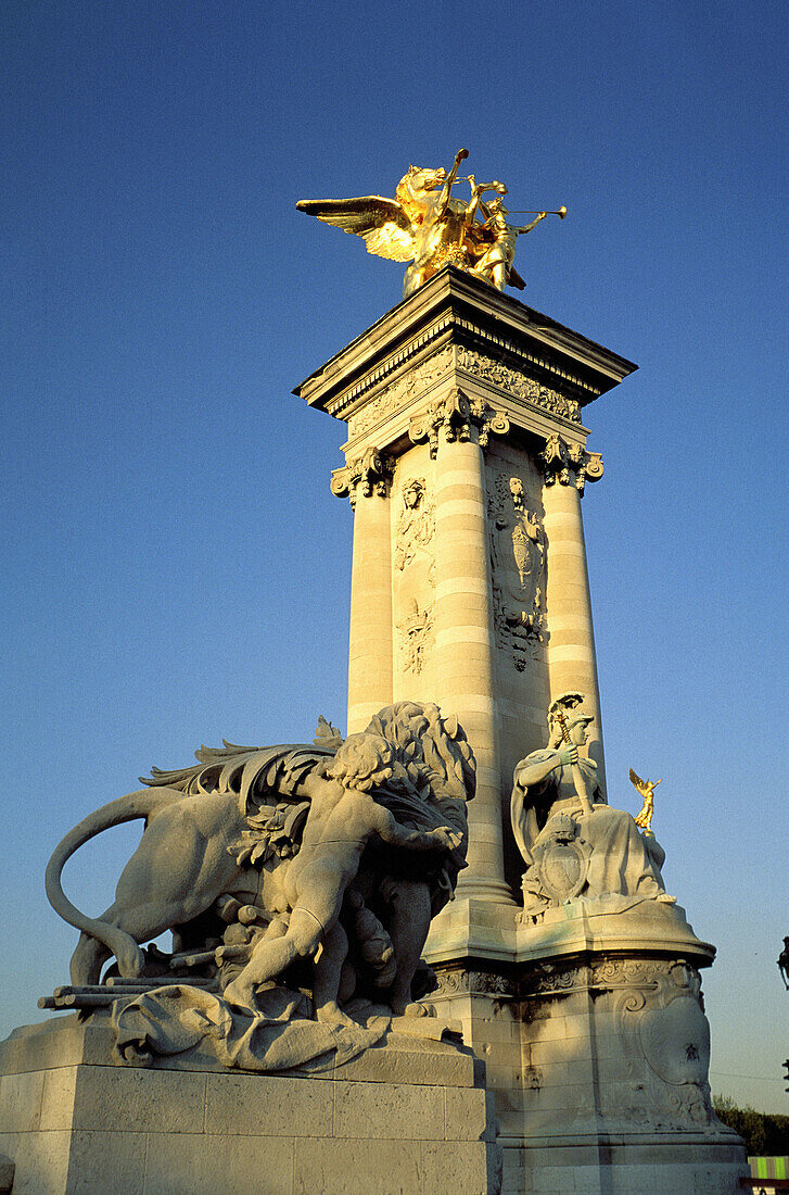 Statues and column of Pont Alexandre III. Paris. France