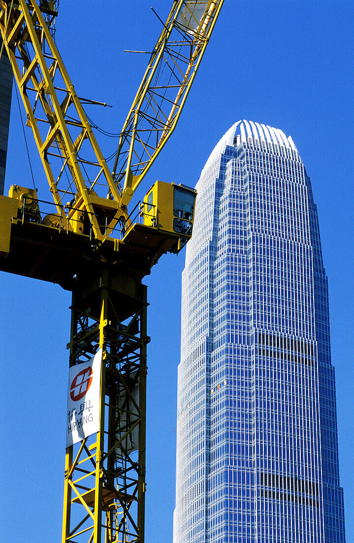 Construction crane by the IFC skyscraper (China highest building 420m). Hong Kong, China
