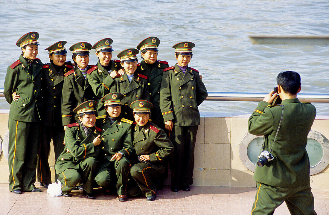 Chinese people and tourists visiting Pudong new town on river bank. Shanghai. China