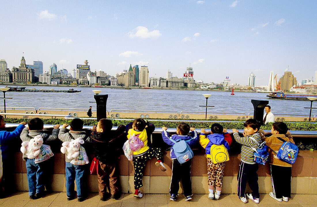 Children looking at the river in Pudong. Shanghai. China