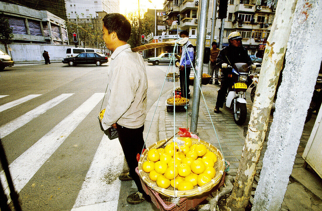 Orange seller, street scene in the old town. Shanghi. China