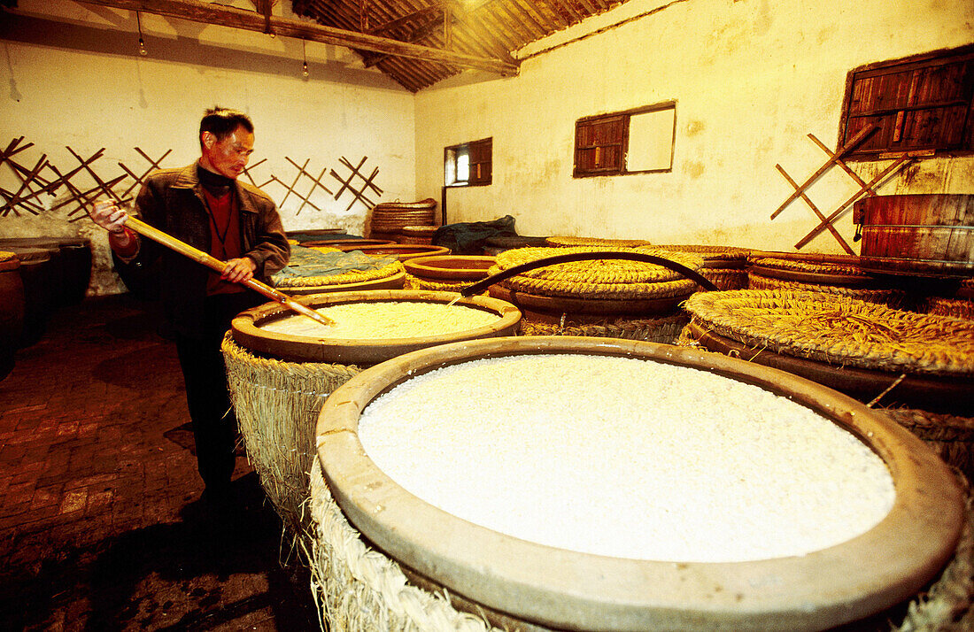 Rice wine and alcohol distillery. Rice vats. Wushen. Zhejiang province, China
