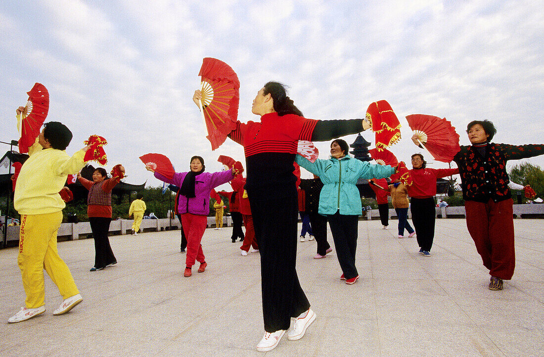 Fan dance in Mao ze dong style practised usually in China nowadays by mature women. Suzhou. Kiangsu province, China