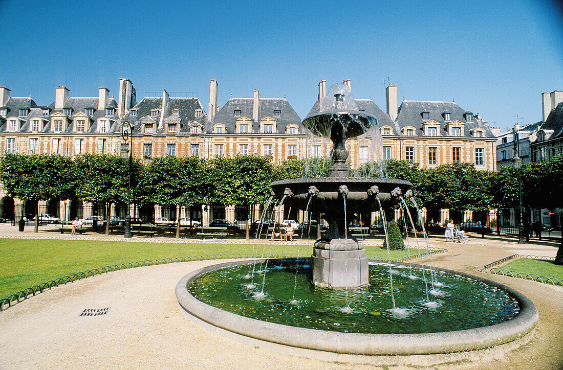 Fountain at Place des Vosges (formerly Place Royal, planned in 1603). Paris. France