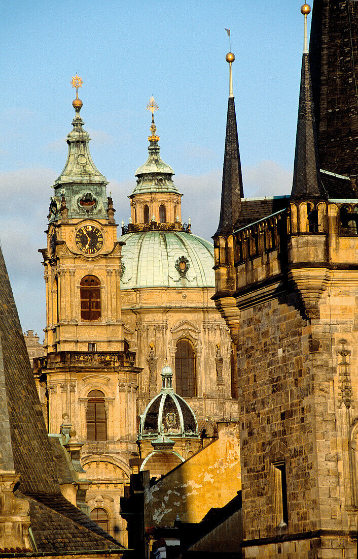 Saint Nicholas baroque church. Charles Bridge Tower at fore. Mala Strana quarter. Prague. Czech Republic.