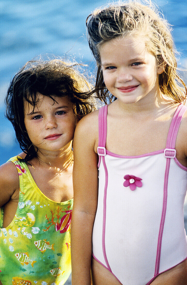 Two little girls bathing. Réunion Island (France) NO MR/EDITORIAL ONLY