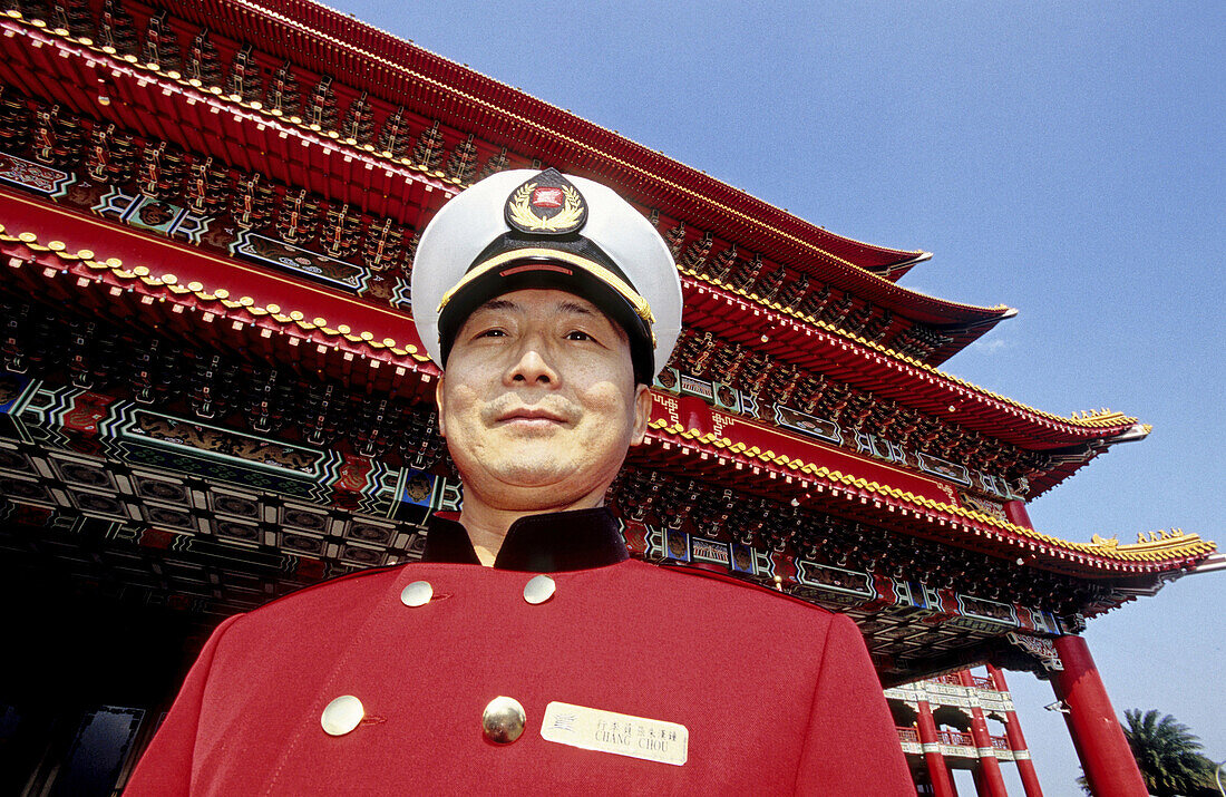 Doorman of the new Grand Hotel, built in supposed traditional Chinese style. Taipei. Taiwan