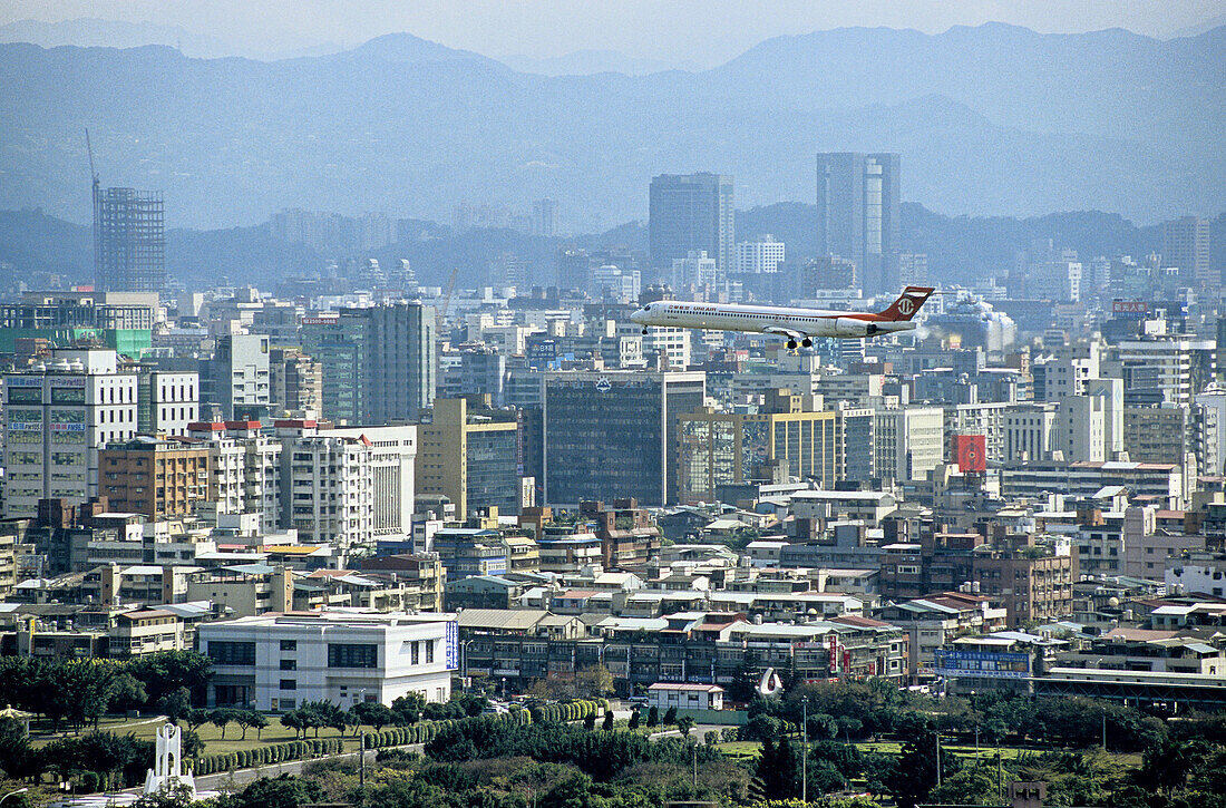 Overview on the city skyline and plane landing. Taipei. Taiwan