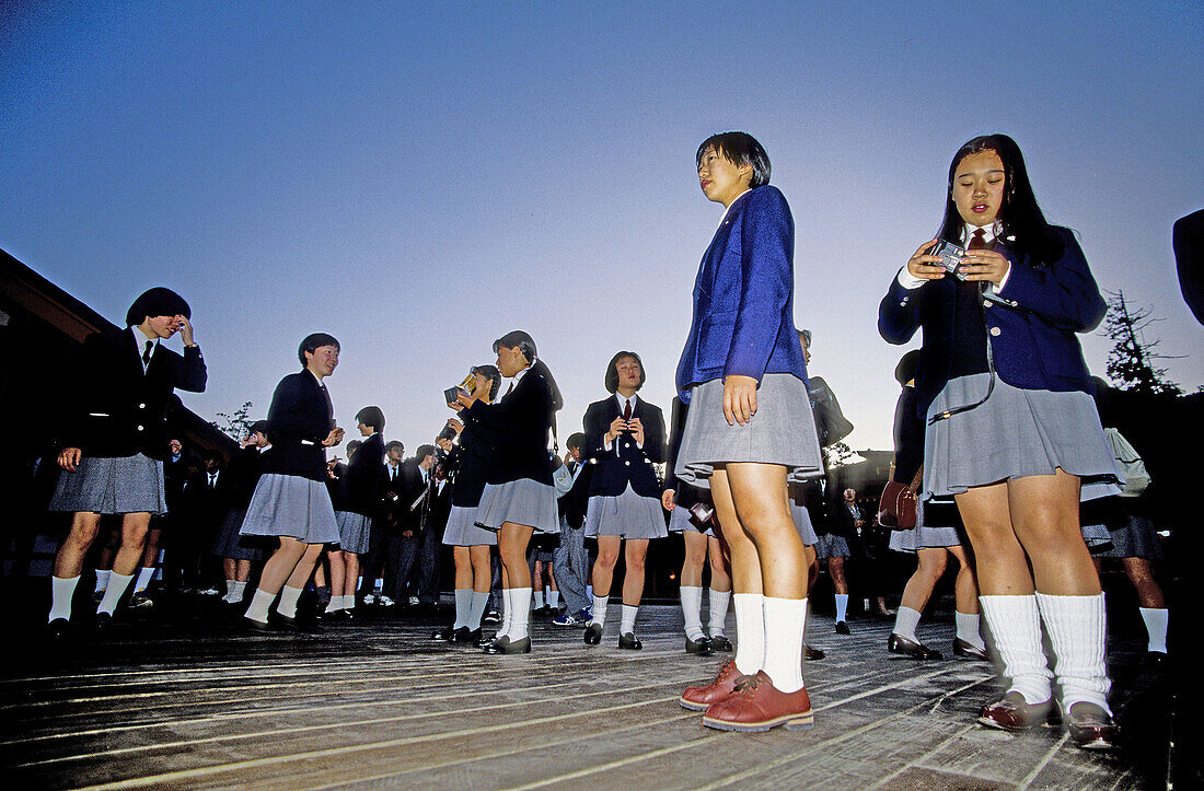 Female scholars visiting the Miyajima island. 20 Km south of Hiroshima, it shelters the important shrine of Itsukushima, founded in the 9th century and famous for its wood portico (Torii), set up in the sea. Japan.