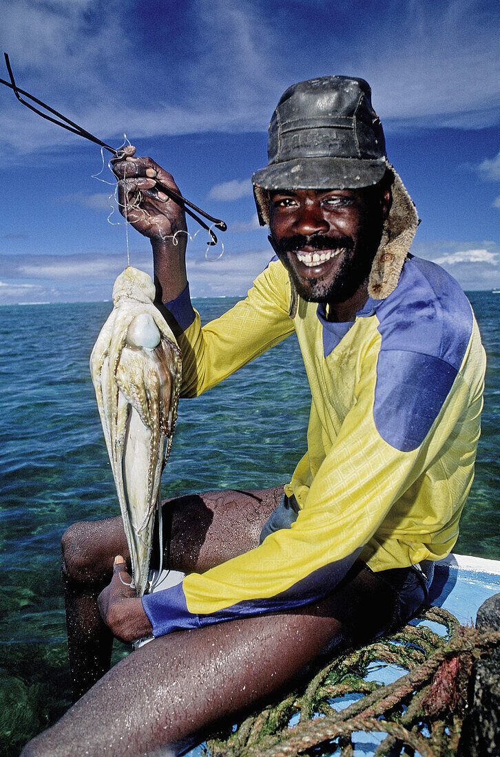 Fisherman with a zourite (octopus). Mauritius.
