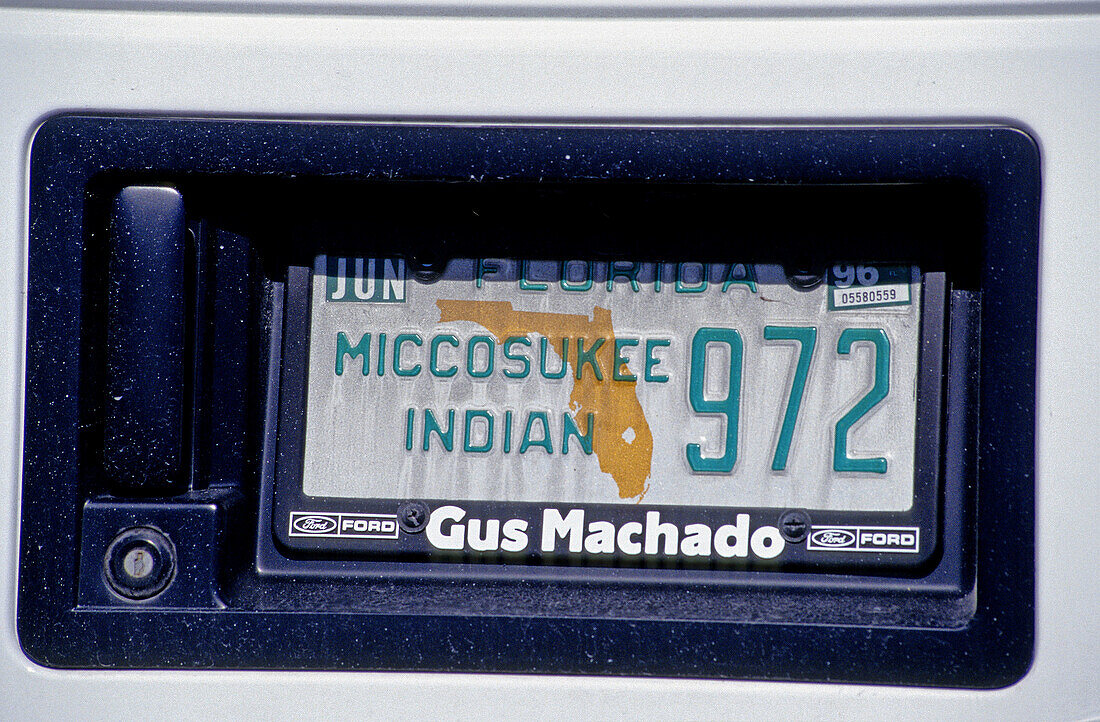 License plate of car, Miccosukee Indian Reservation sign. Everglades. Florida, USA