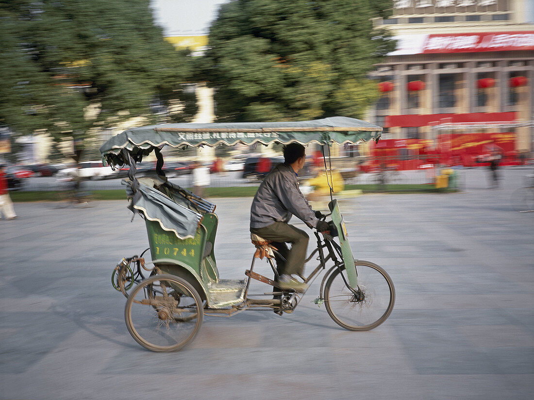 Rickshaw in motion. Shanghai, China