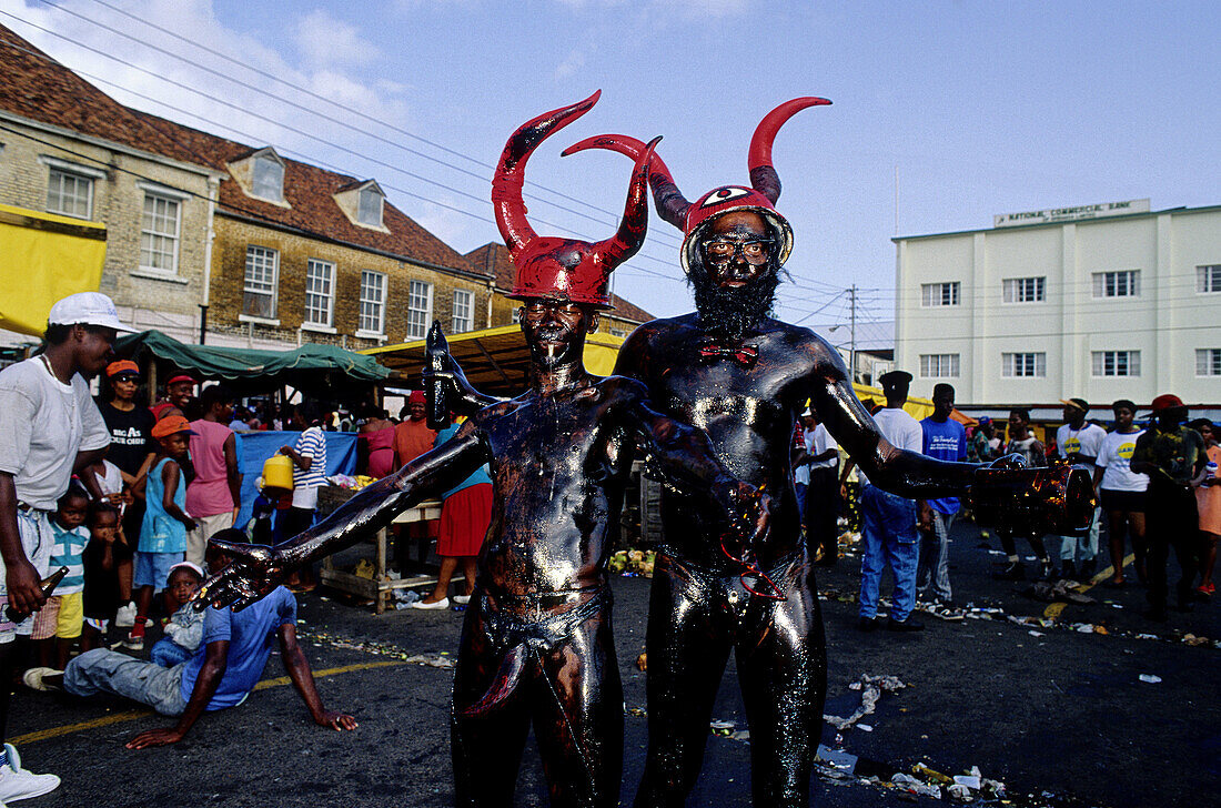 The Jab-Jabs likely lads who disguise into kind of black devils with horns and the body covered with waste motor oil.Mardi-Gras parade and preparation. Carnival. Grenada island. Caribbean