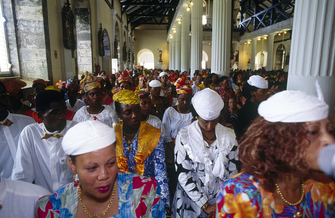 Sunday mass in Sainte-Marie with ladies dressed in traditional attire. Martinique, Caribbean, France