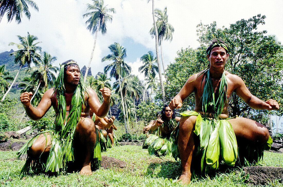 Local men and women performing the traditional Pig Dance in Hatiheu. Nuku-Hiva island. Marquesas archipelago. French Polynesia