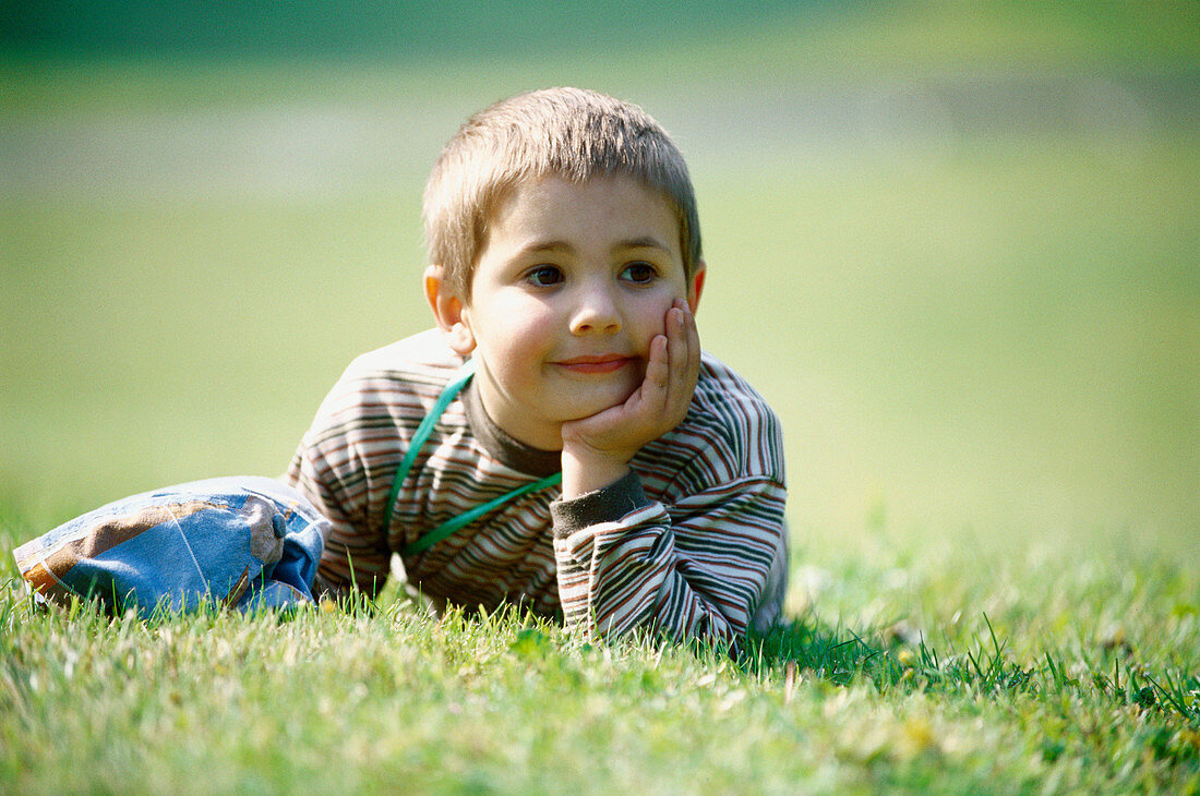 d, Children, Color, Colour, Contemporary, Daytime, Exterior, Facial expression, Facial expressions, Garden, Gardens, Grass, Grin, Grinning, Horizontal, Human, Innocence, Innocent, Kid, Kids, Lawn, Lea