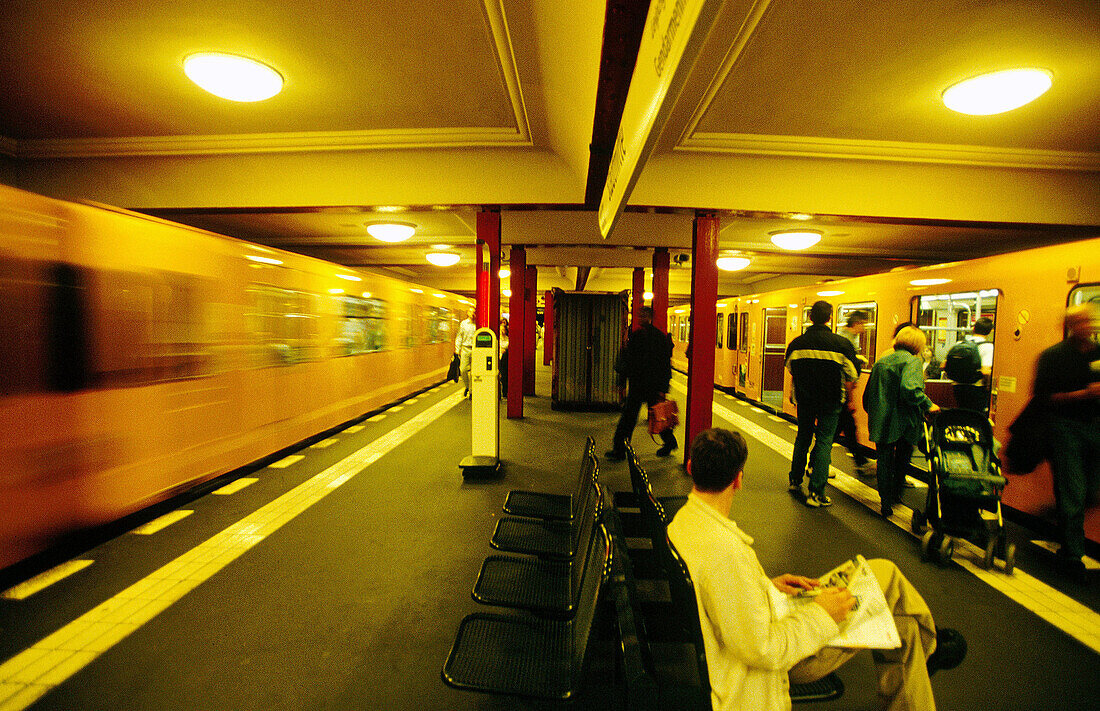 Urban railway station, blurred train leaving. Berlin. Germany