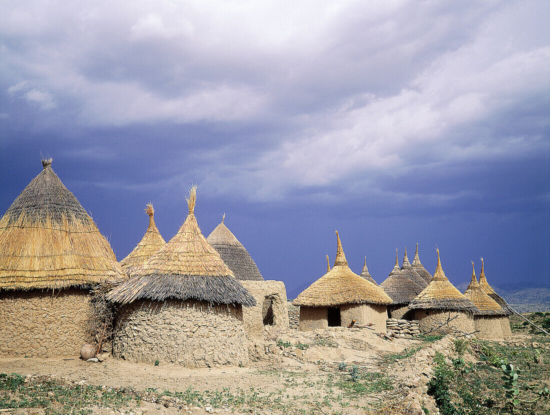 Family compound of adobe cabins and straw roofs. Matakam tribe (aka Mafa or Kirdi ). Mandara Mounts. North Cameroon