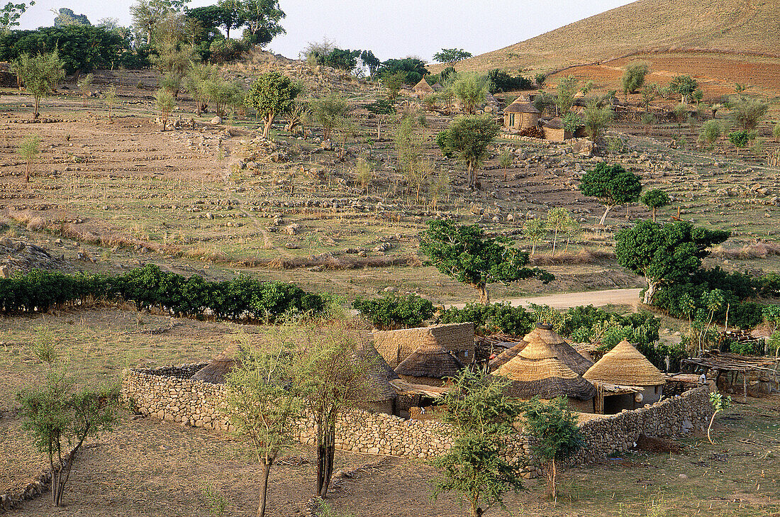Elevated view of a typical Kapsiki compound at dusk. Rumsiki village (Kapsikis tribe). Mandara Mounts. North Cameroon