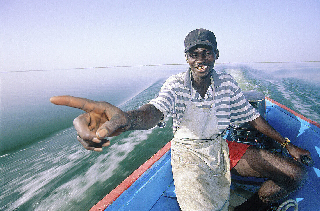 Pilot crossing the river to the Hotel Relais de la Somone . Foundiougne. Sine Saloum province. Senegal