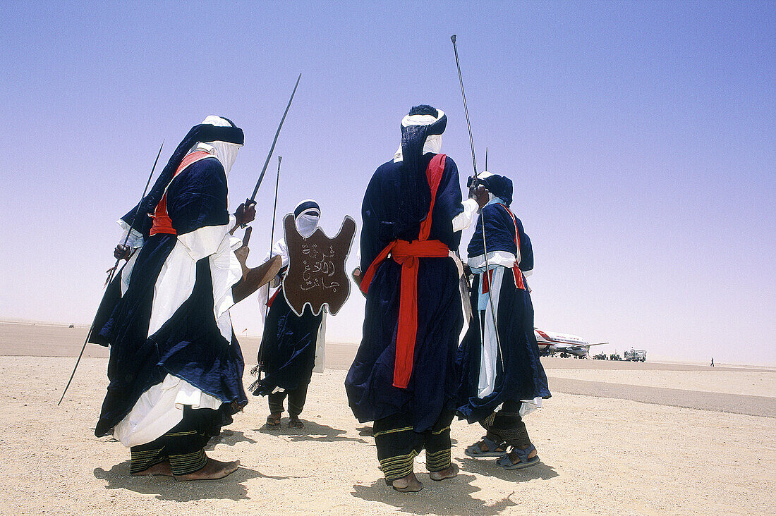 Tuaregs dancing to welcome visitors at the airport. Tassili N Ajjer. Djanet Oasis. Algeria