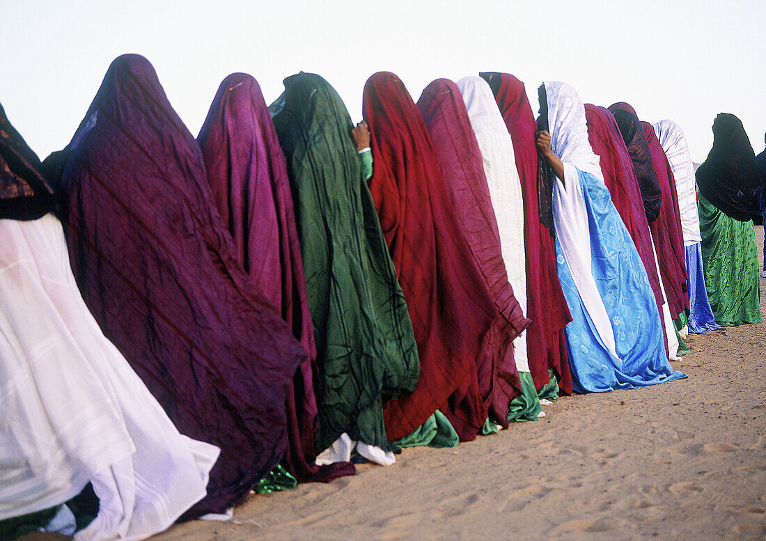 Group of tuareg woman singing and clapping during the Sebiba Festival. Djanet Oasis. Tassili n Ajjer. Sahara. South Algeria