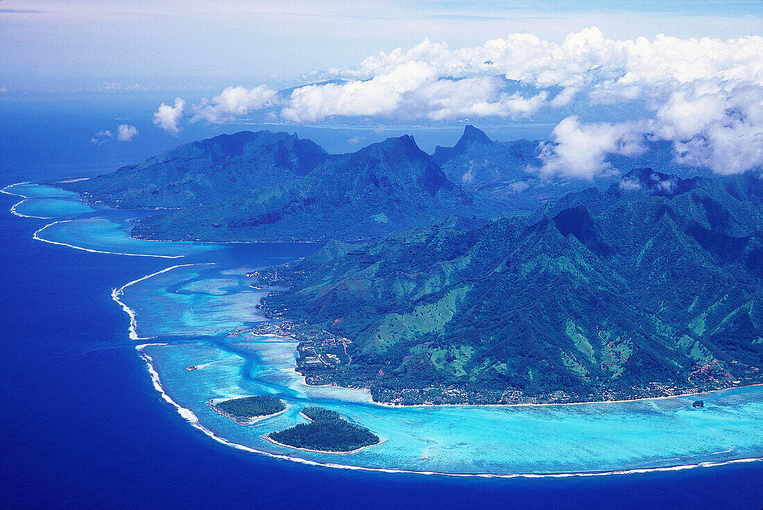 Aerial of Haapiti lagoon and islets and Opunohu bay on left. Moorea island. Windward Islands. French Polynesia