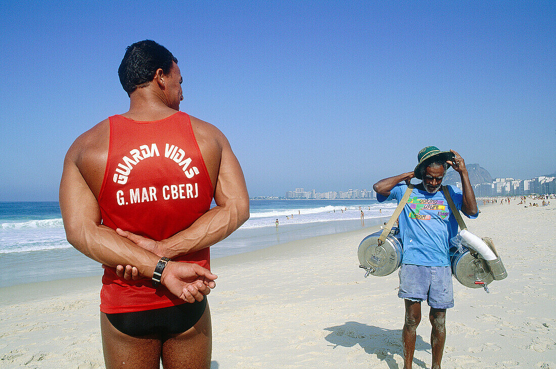 Life guard on duty and old tea seller. Copacabana, Rio de Janeiro. Brazil