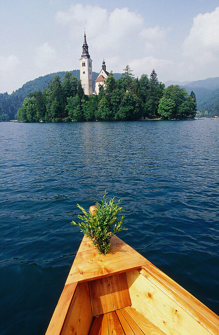 Going to the church of vows. Bled lake. Julian Alps. Slovenia