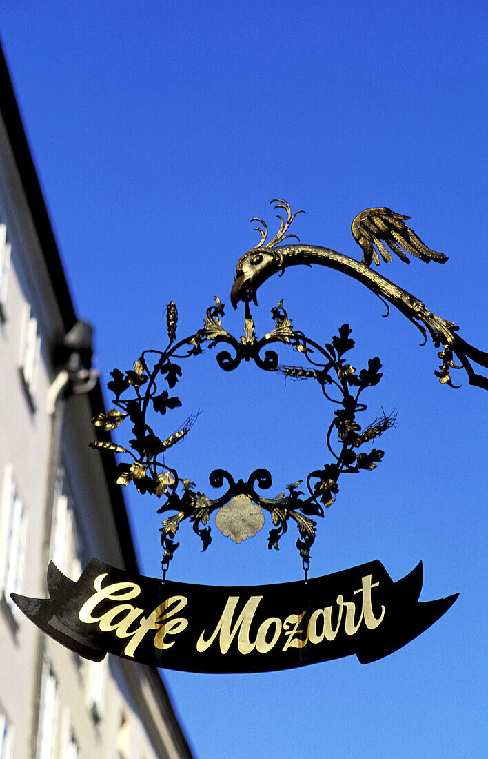Antique wrought iron sign. Cafe Mozart. Getreidegasse pedestrian street. Salzburg. Austria