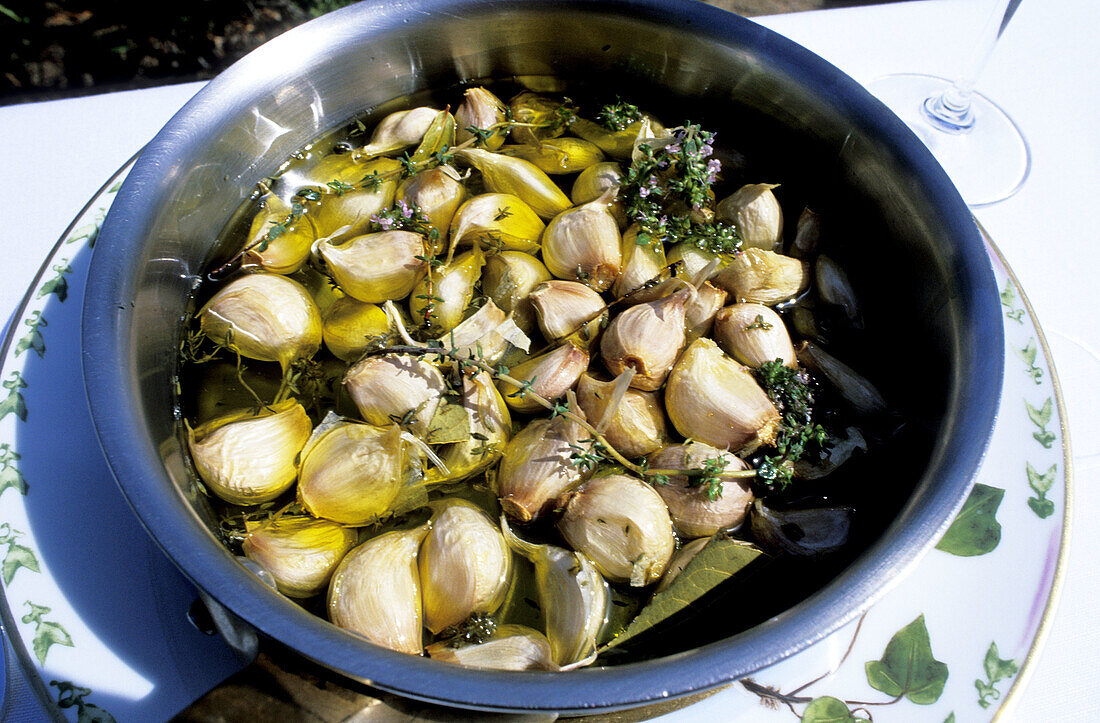 Garlic cooked in olive oil. Restaurant La Villa , Jean-Pierre Pinelli owner. Haute-Corse. Corsica Island. France