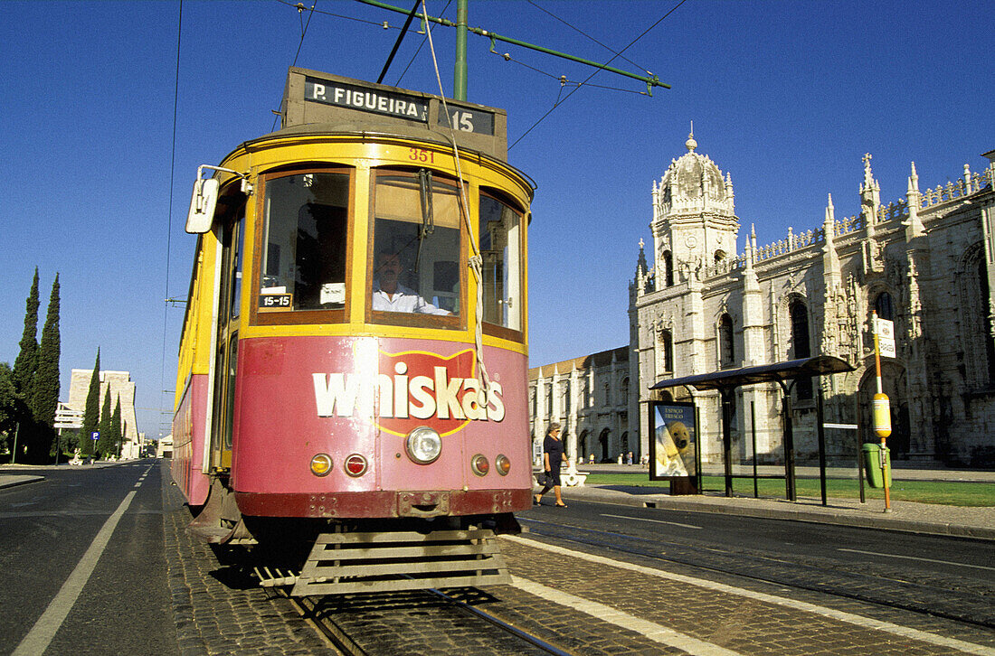 Local Tramway Electrico passing by the Monastery of the Hieronymites. Lisbon. Portugal