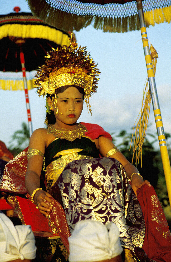 Young girl playing the incarnation of a Goddess. The Great Odalan for Singapadu Temple. Bali Island. Indonesia