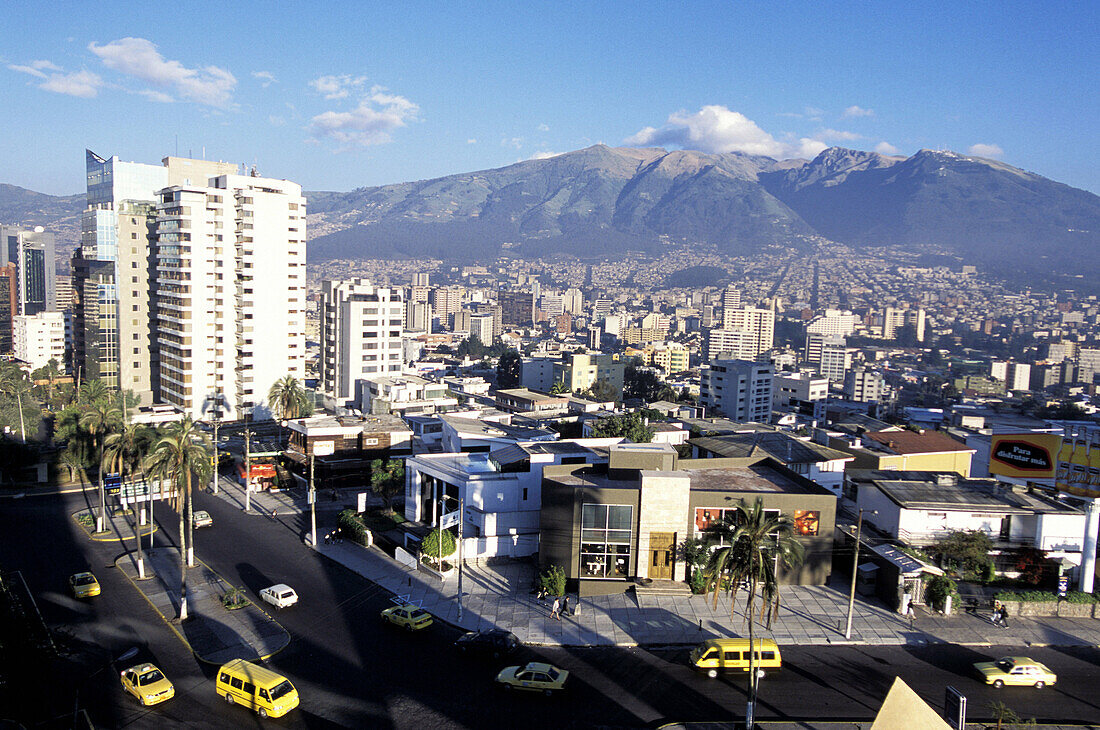 The new town and Rucu Pichincha (4790 m) in background from Hotel Quito terrace. Quito. Ecuador