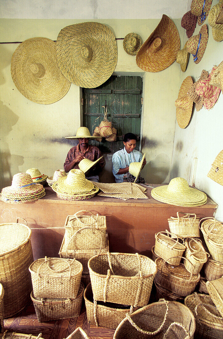 Husband and wife basket makers in their basket shop and workshop. Rodrigues Island. Mauritius