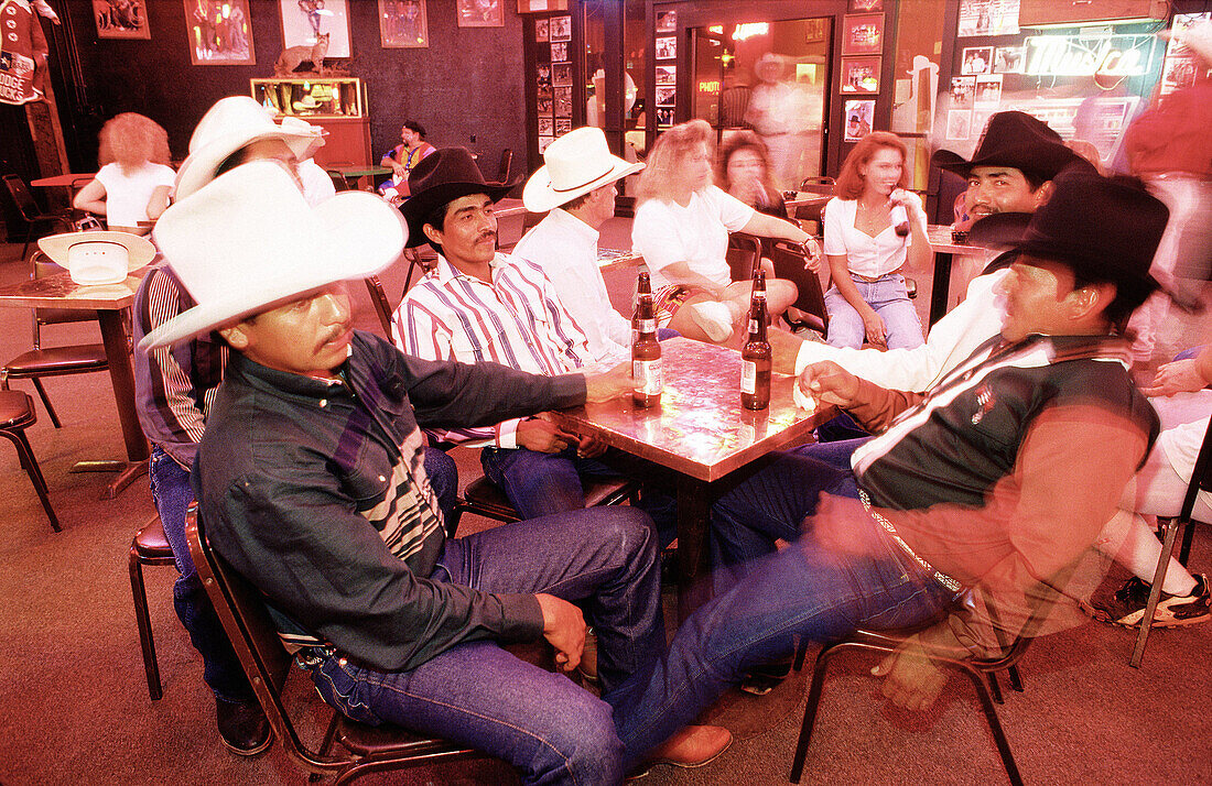 Men having a drink at Billy Bob s frontier bar. Stockyards, Fort Worth. Texas, USA