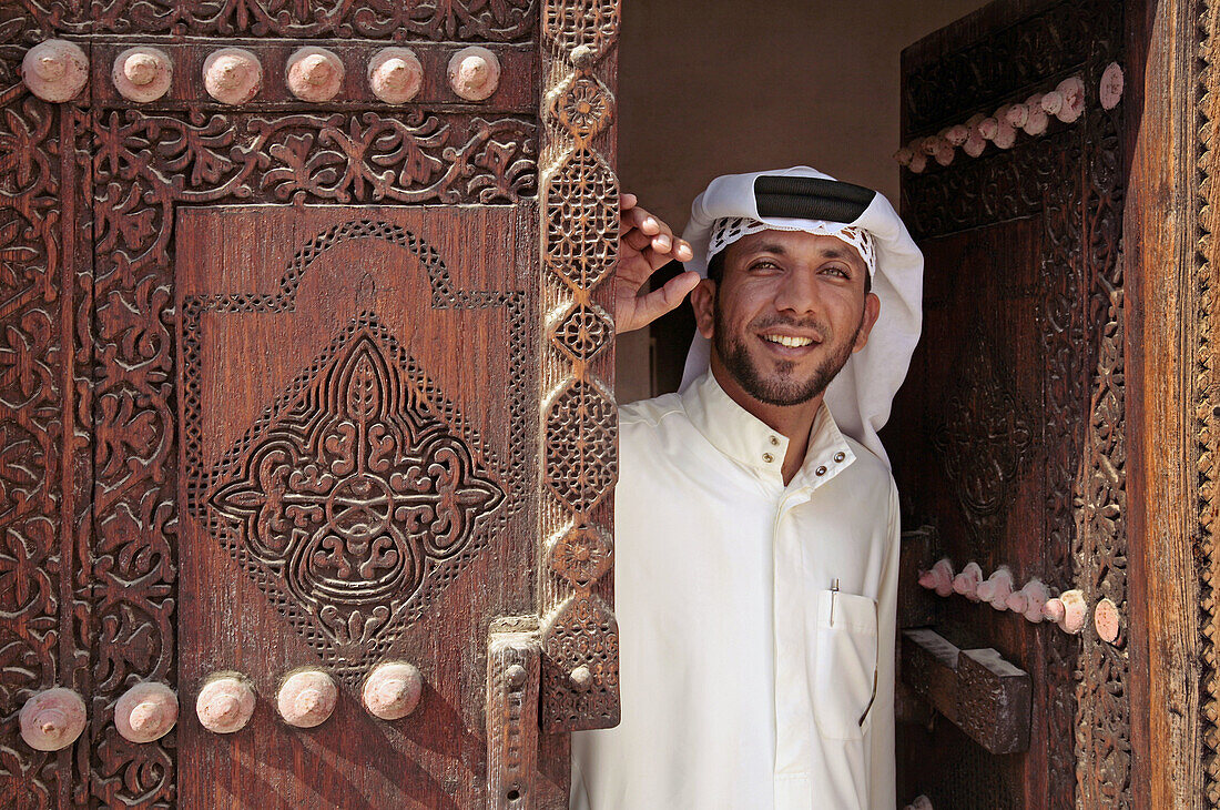 Anouar Jalil Slalouibi, by a XVIIIc. door at the Sheik bin Ali House at Muharraq. Manama. Bahrain