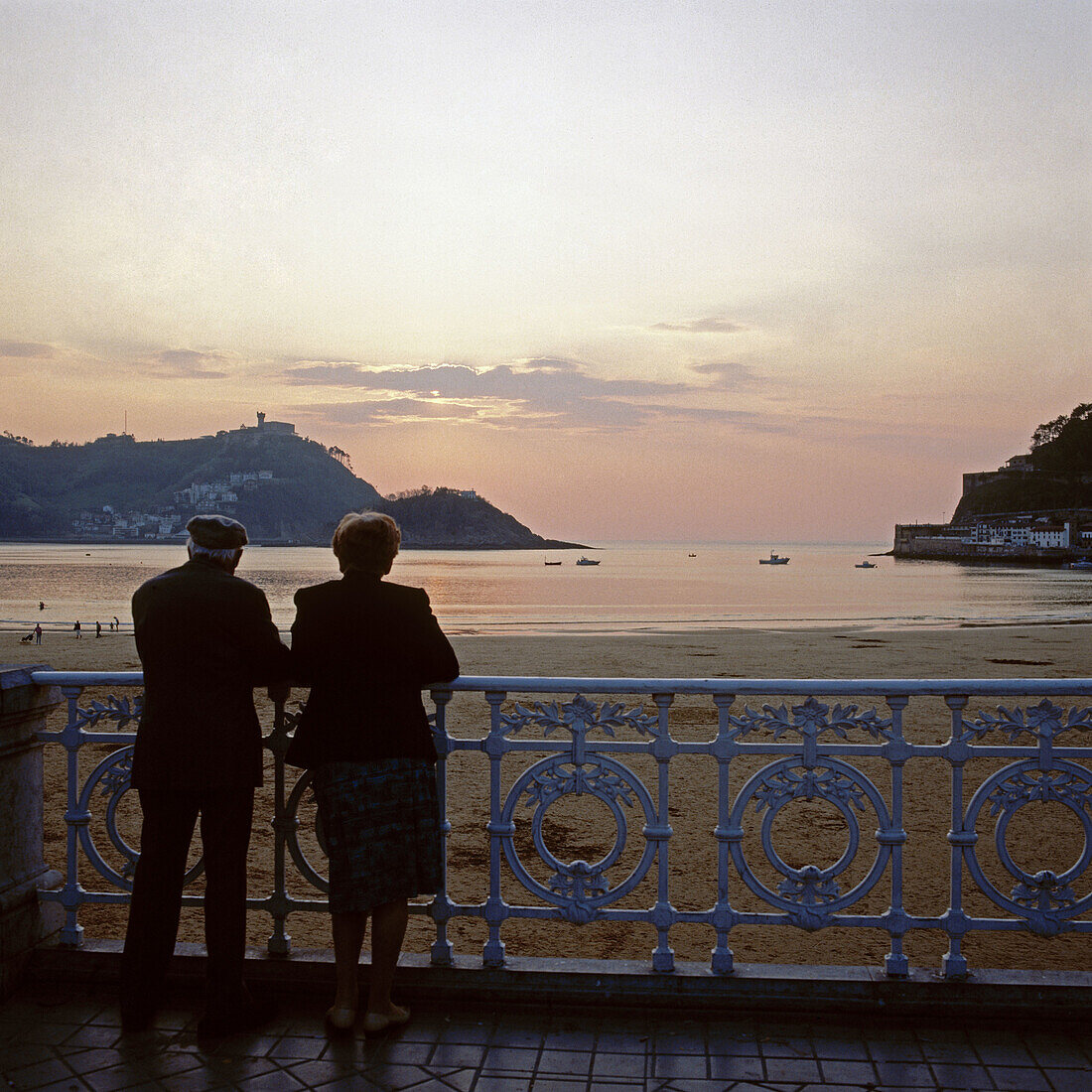 Elderly couple looking to San Sebastian Bay. Guipuzcoa, Basque Country, Spain