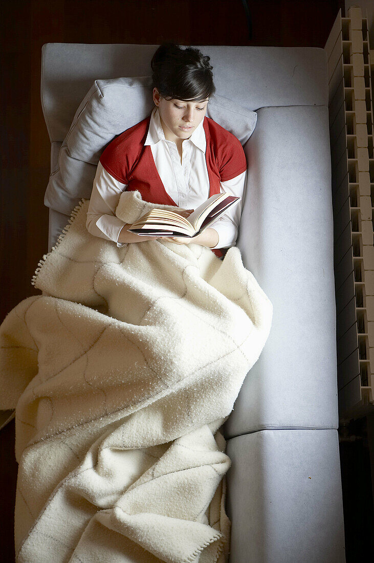 Young girl relaxing in a Villa at Aranzazu, Aizkorri Natural Park, near Oñati. Gipuzkoa, Basque Country, Spain