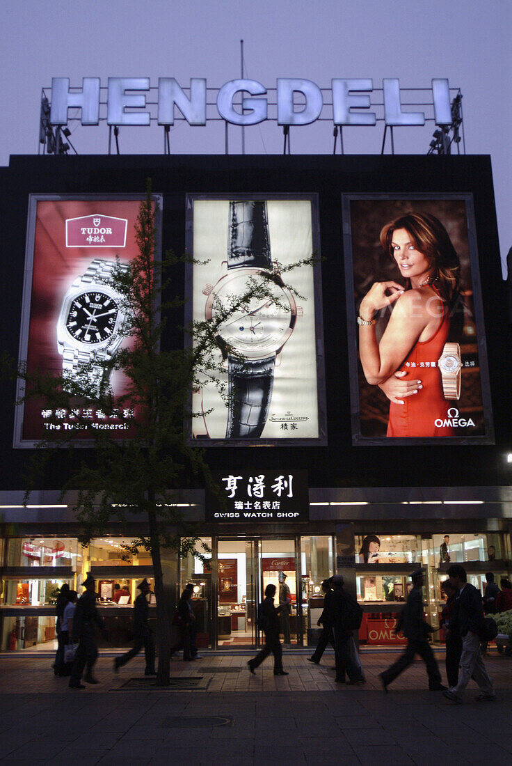 Signs showing new advertising culture and foreign brands. Beijing, China