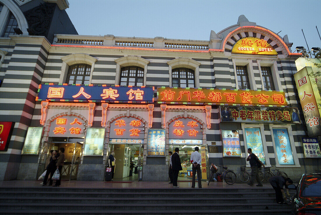 Tiananmen Square at night, shopping centre around old train station. Beijing. China