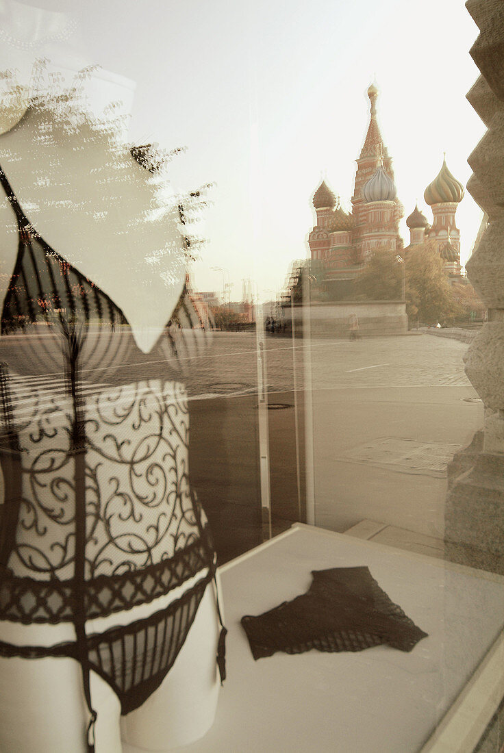 Moscow, Russia, Red Square, GUM Department Store, Western brand boutiques windows with reflections.