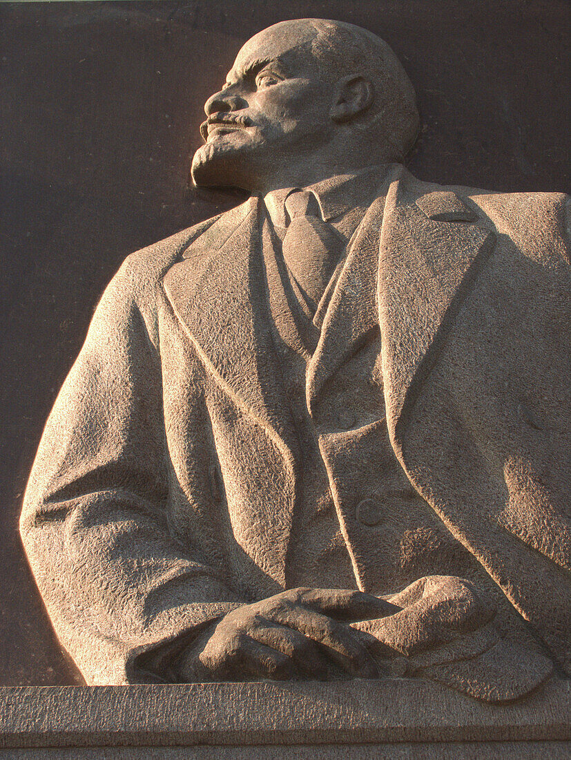 Moscow, Russia, stone carvings of Lenin on building exteriors.