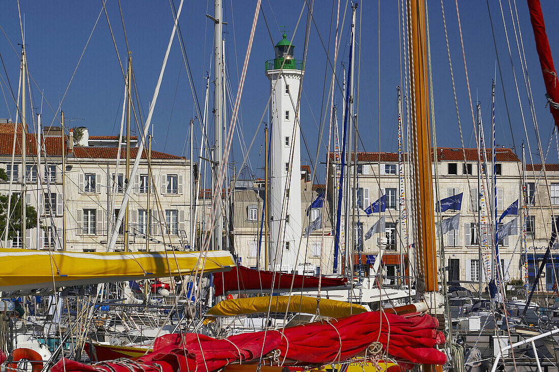 At the harbour of La Rochelle with boats and lighthouse, Charente-Vendée, dept Charente-Maritime, France, Europe