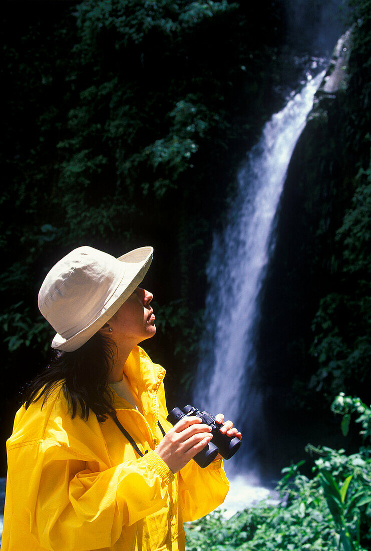 Bird watcher, La paz waterfall, Volcano poas National Park, Costa Rica.