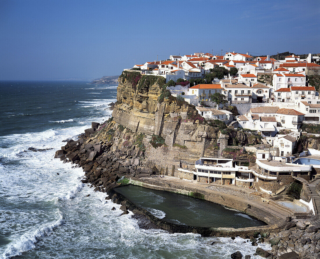 Azenhas do Mar village built on a jugged cliff and Atlantic Ocean. Estremadura. Portugal.