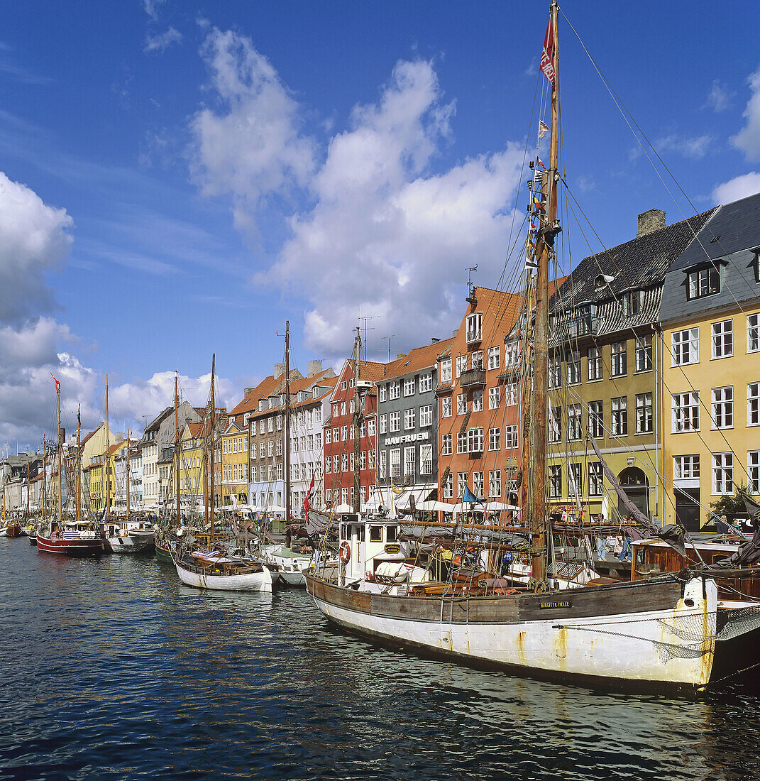 Moored sailboats and ancient houses, Nyhavn (new harbour), Copenhagen. Denmark
