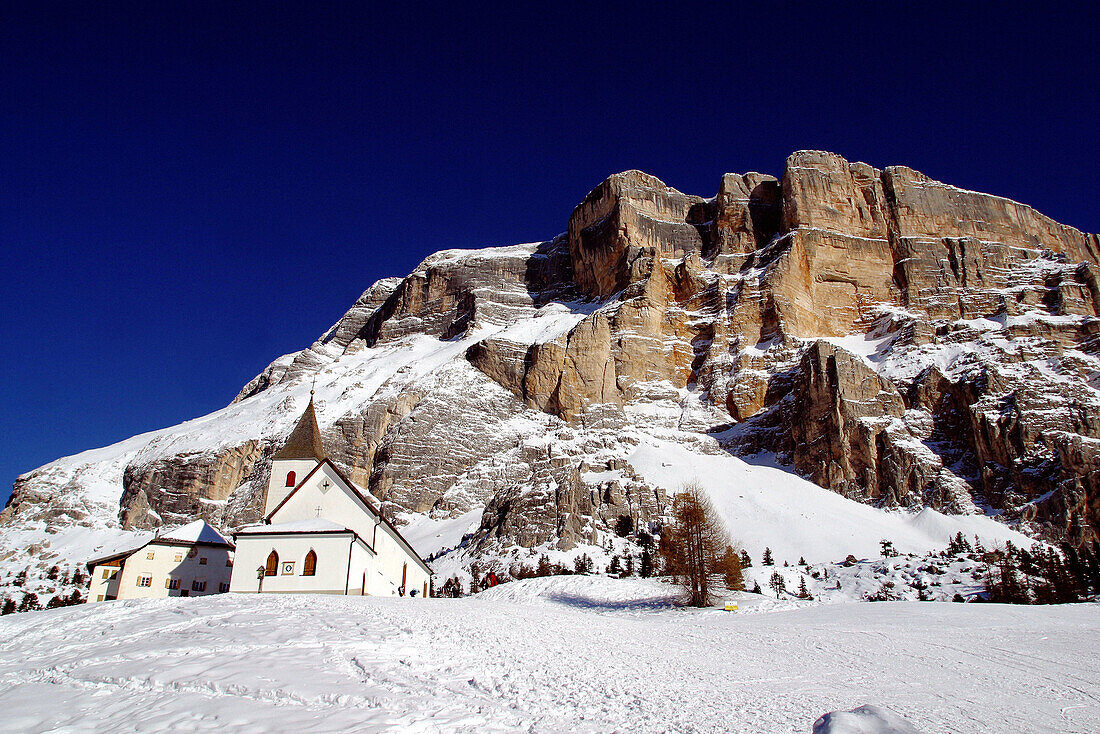 Santa Croce church (built 1484) and Sasso della Croce (2907 mt.). Val Badia. Trentino-Alto Adige. Italy