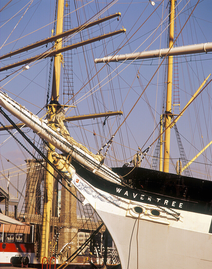 Tall ships and Brooklyn Bridge. South Street Seaport Museum. East River, New York City. USA