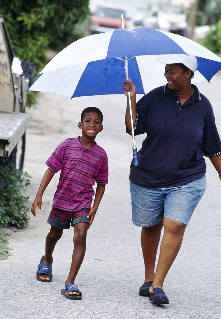 Mother and son, Harbour Island. Eleuthera, Bahamas